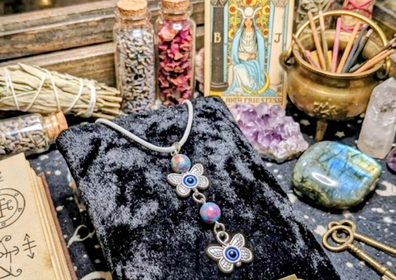Butterfly & Evil Eye Charm Necklace — Multi-Color Beads on Beige Cord