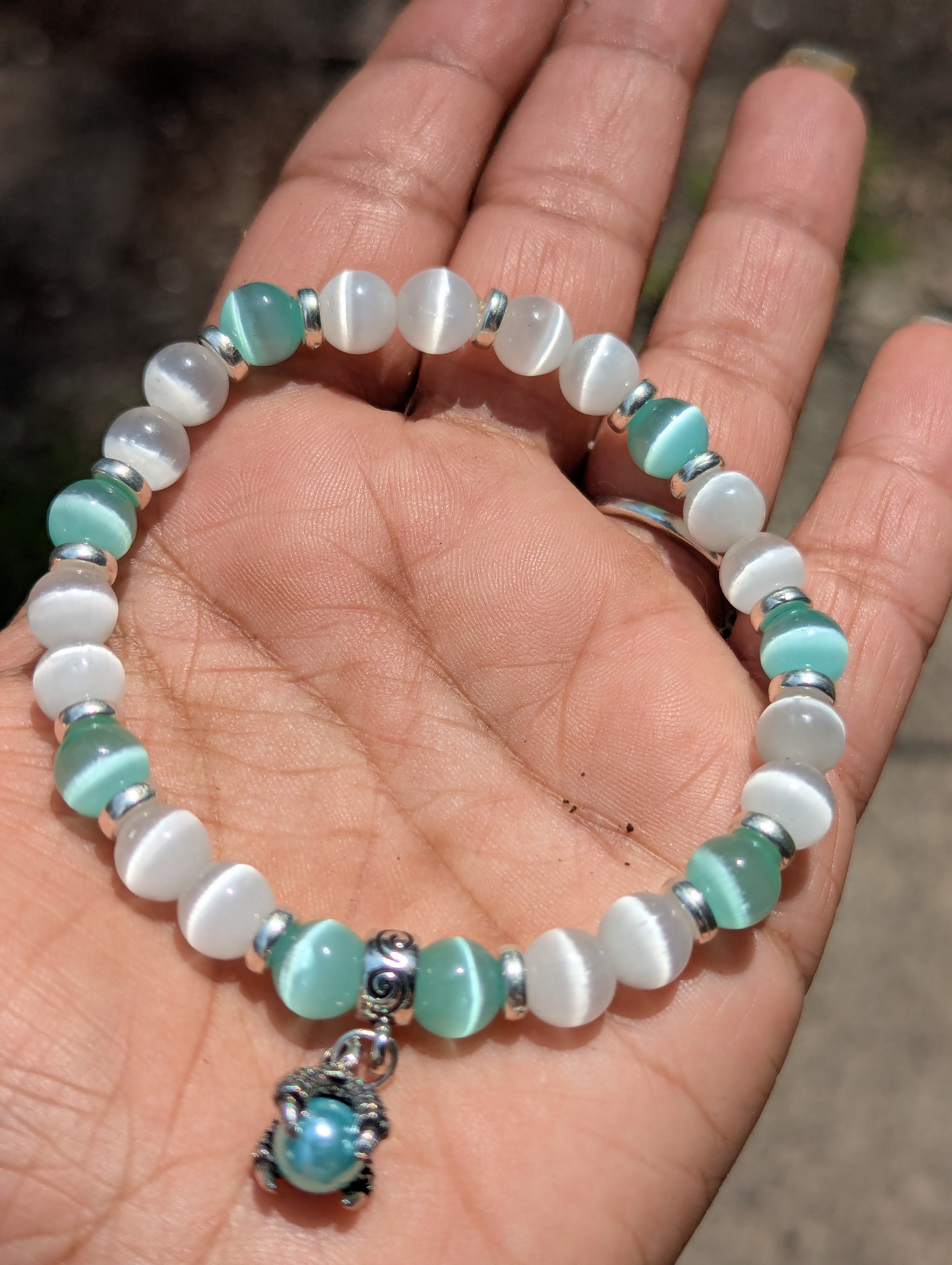 Cats Eye beaded bracelet aqua blue and moonstone white w/ dragon claw charm