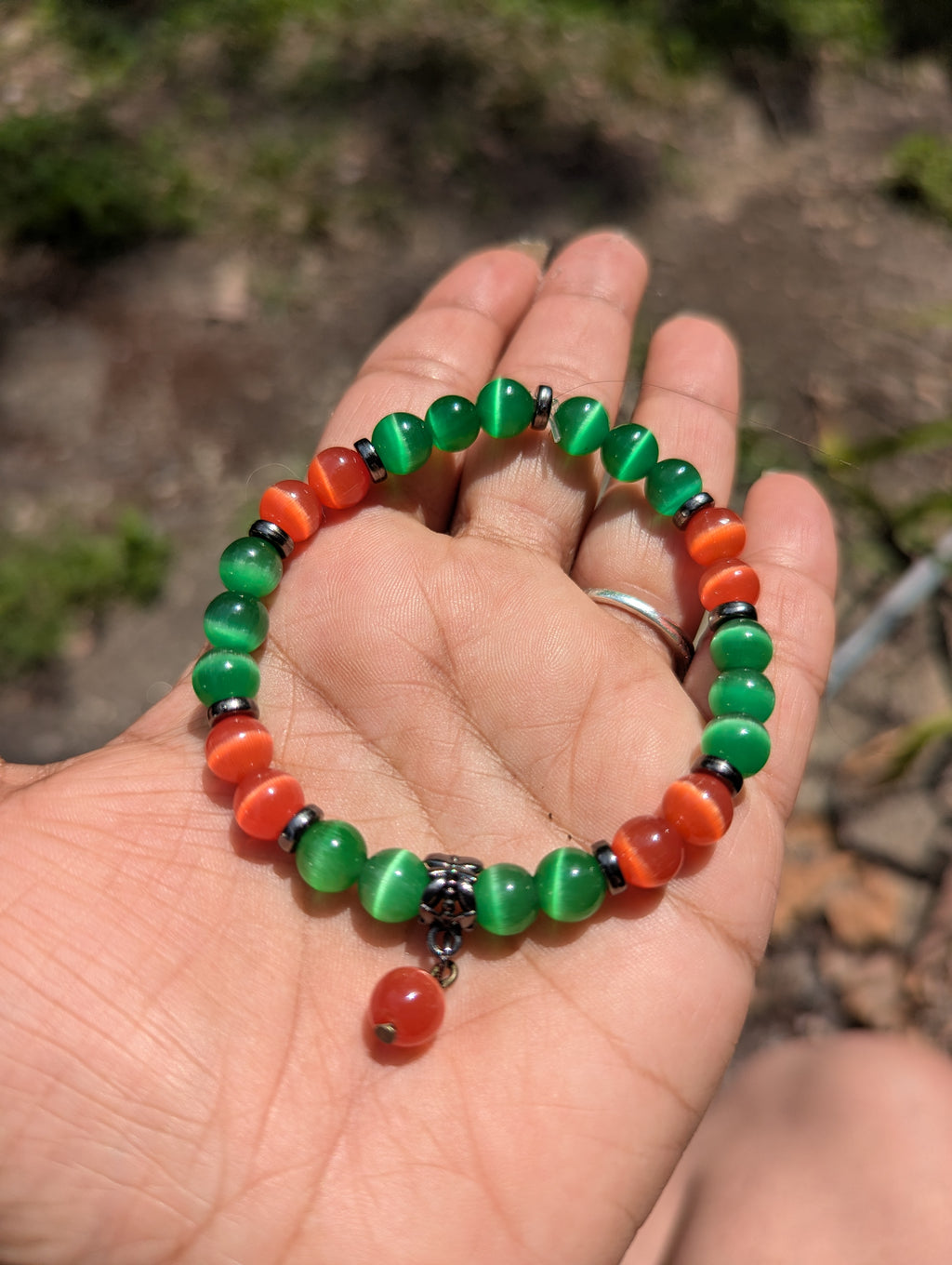 Emerald green and ember beaded cats eye bracelet